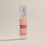 A product shot of the Powder Room Linen spray shot on a dark cream background.
