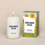 A lit Sunflower Fields Homesick candle displayed next to its boxed packaging on a dark cream background.