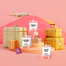 Lifestyle image of three mini candles labelled "Sanitorini Cliffs", "Italian Villa", and "Parisian Lights" in a travel setting