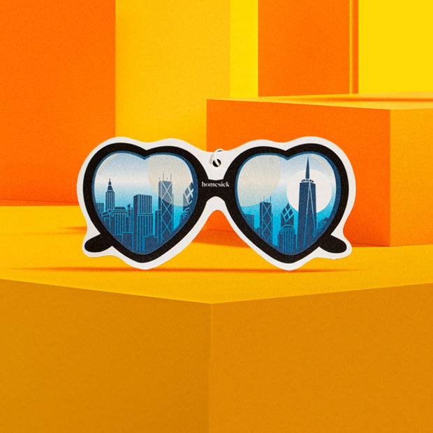 Lifestyle image of a car freshener in an abstract scene
