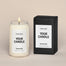 A generic Homesick candle that is lit. The candle label and its packaging display where a customized logo can be added.