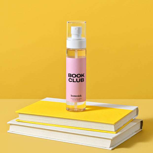 A bottle of Book Club Room Spray.