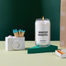 A camera match holder next to the Winter Mantel Candle.