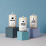 A group product shot of the Northeast inspired candles offered at Homesick. Each are displayed on cube pedestal but each are a different shade of blue. The candles shown are Connecticut, New York and New Jersey.