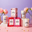 A group shot of all the Love inspired candles at Homesick. They were shot on a light pink surface with a light purple background. Left to right is the Mickey Mouse Candle, Minnie Mouse Candle and the Love Letters candle