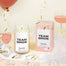 A stylized shot of the Team Bride candle with bachelorette props around the candle.